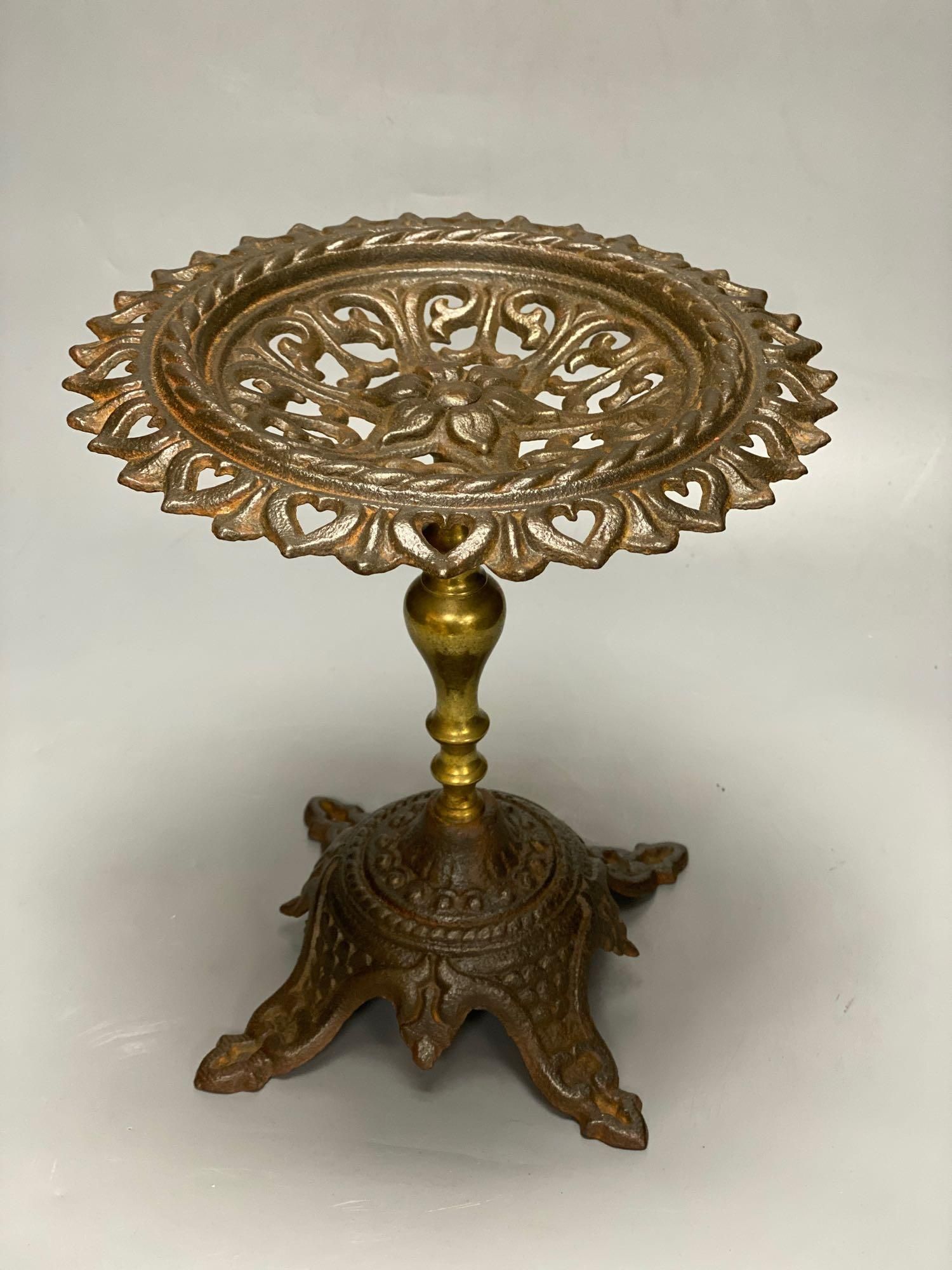 A 19th century primitive beech rectangular dish, carved from the solid, 64cm, a Victorian cast iron pedestal stand, 28cm and a model wo